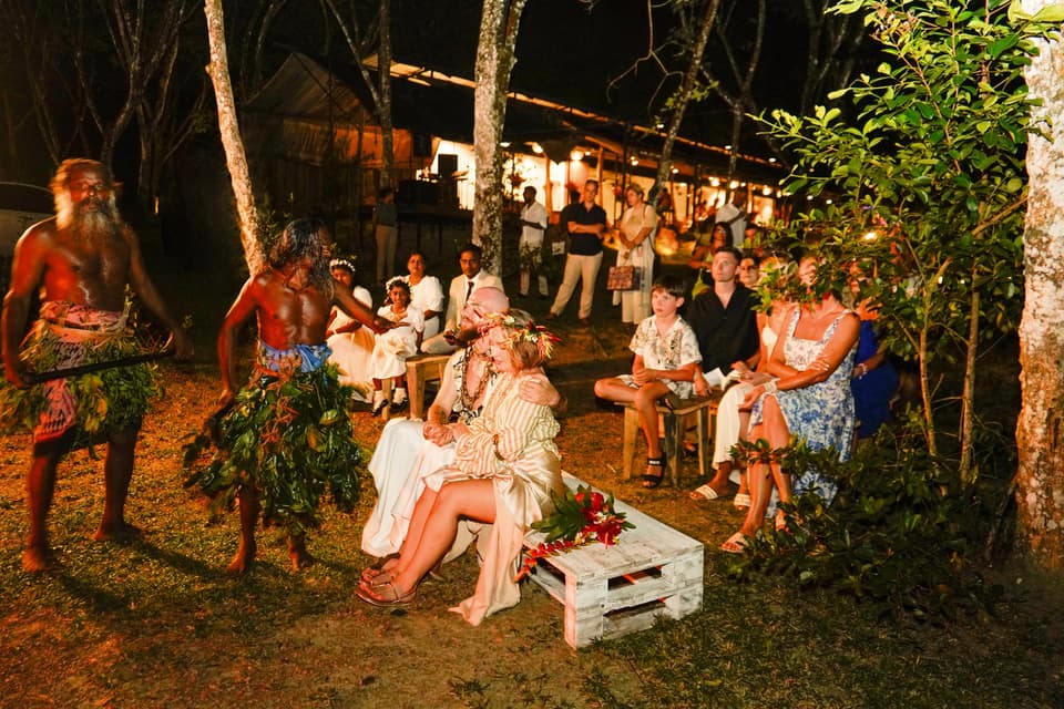 Dancers in traditional dress performing for the couple and their guests at night